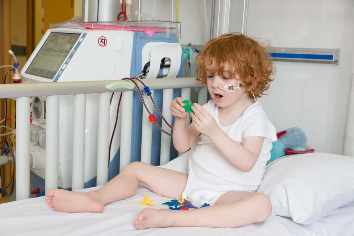 Child in hospital receiving dialysis