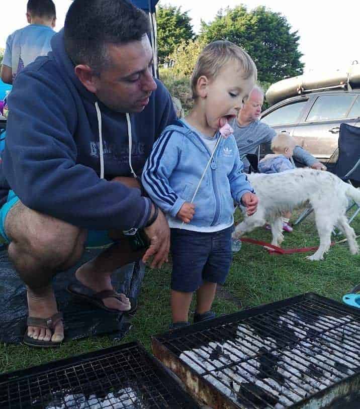 child eating marshmallow