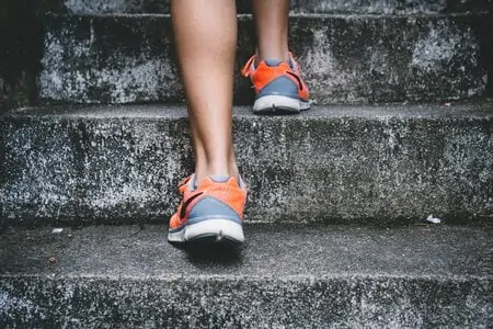 person walking up steps