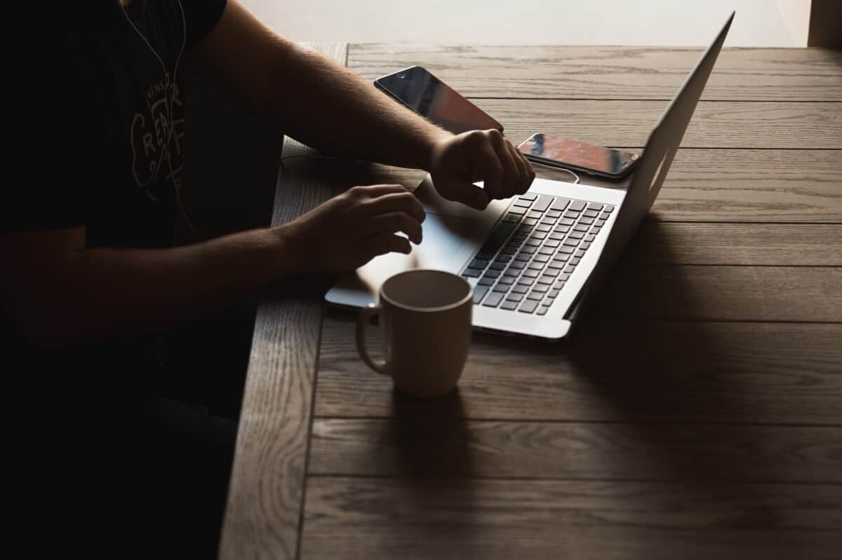 person typing on laptop