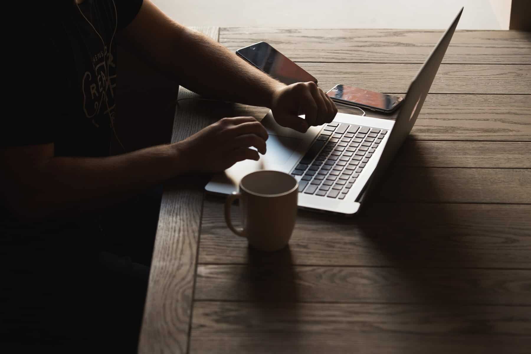 person typing on laptop