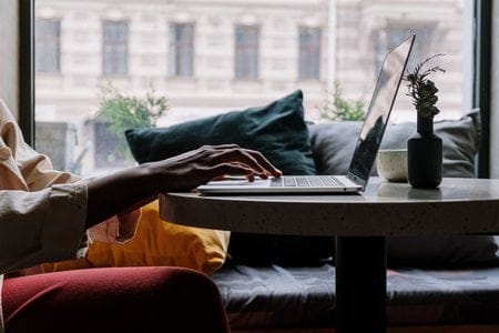 person typing on laptop