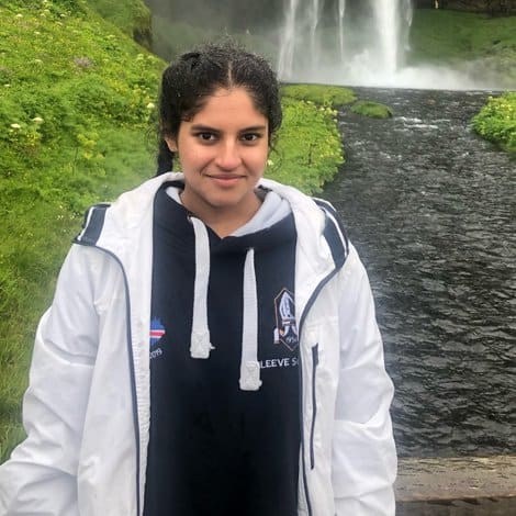 girl in front of waterfall