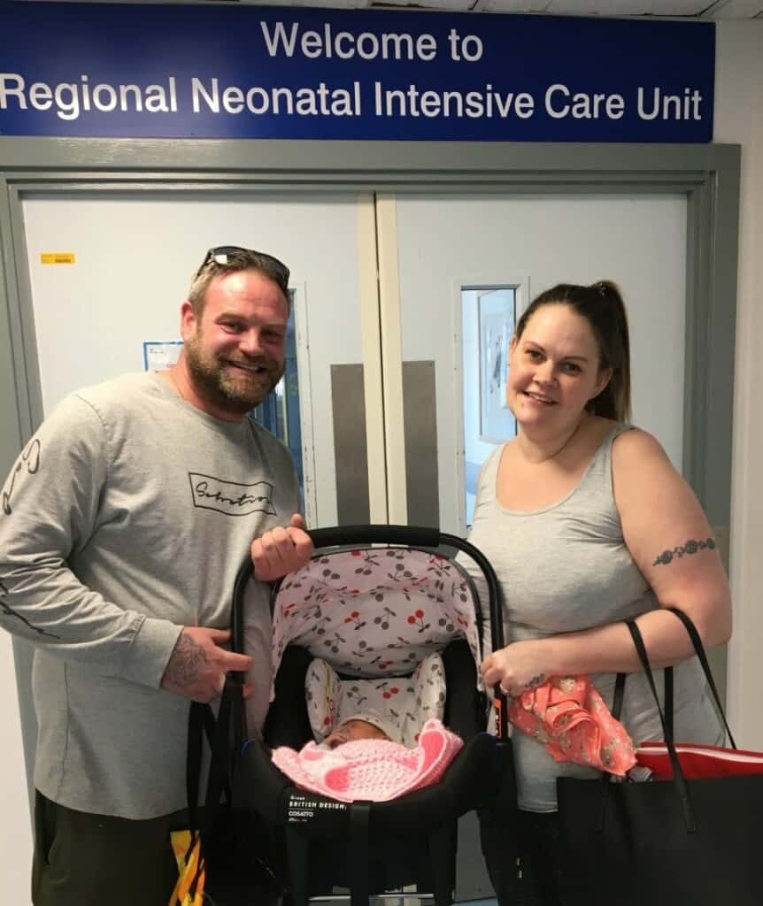 Avalon with her mum and dad at the doors of St Michael's Neonatal Intensive Care Unit. 
