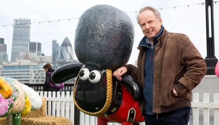 nick park with a shaun sculpture