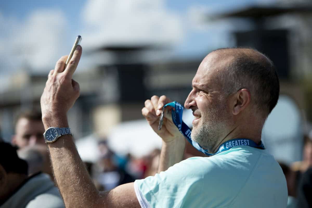 Man holding a medal.