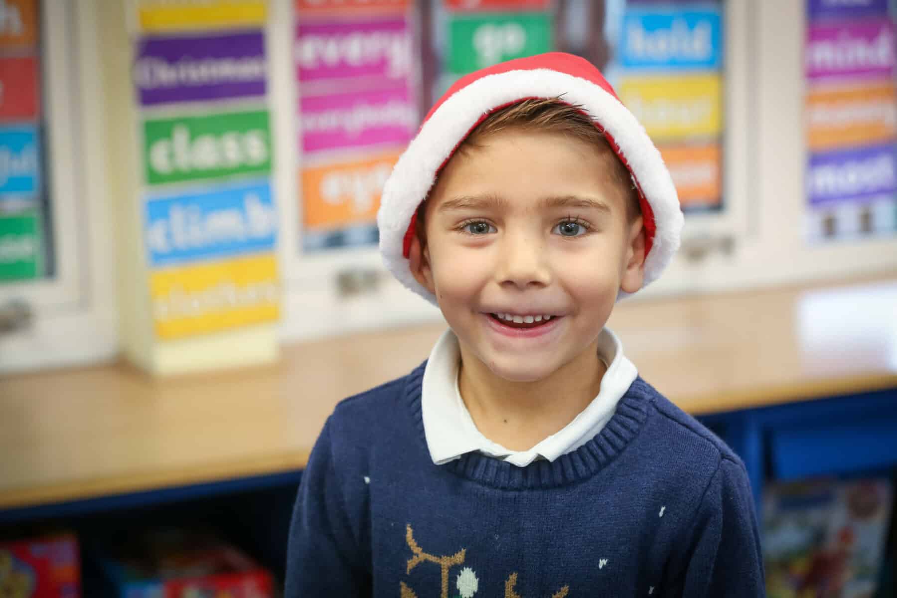 A child in a Santa hat