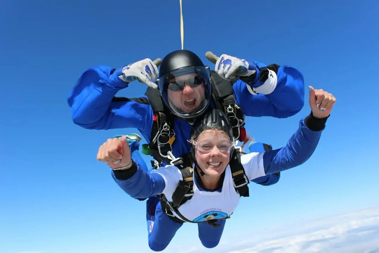 Woman tandem skydiving