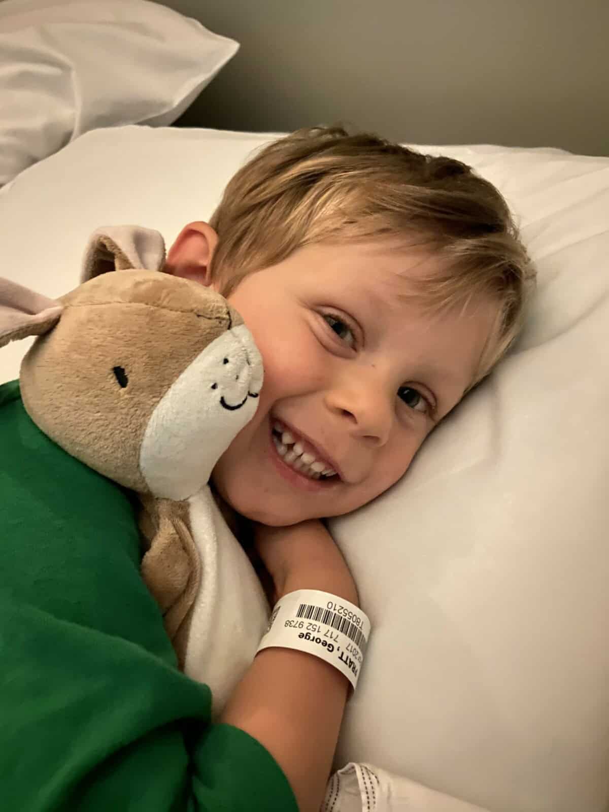 Young boy holding a toy