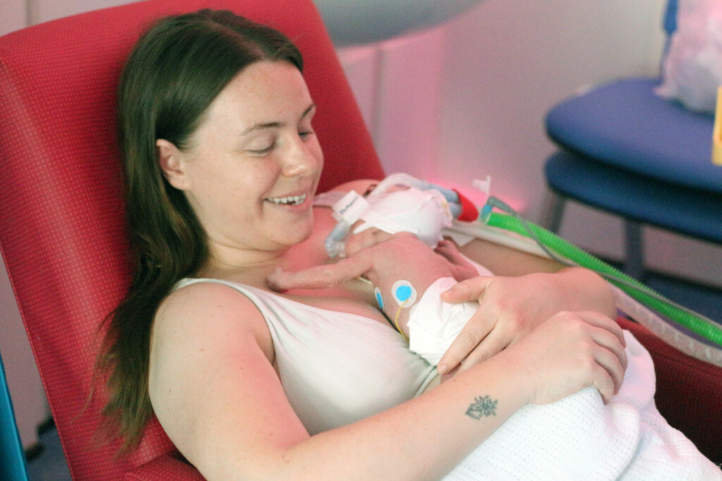 Mum practicing kangaroo care with baby.