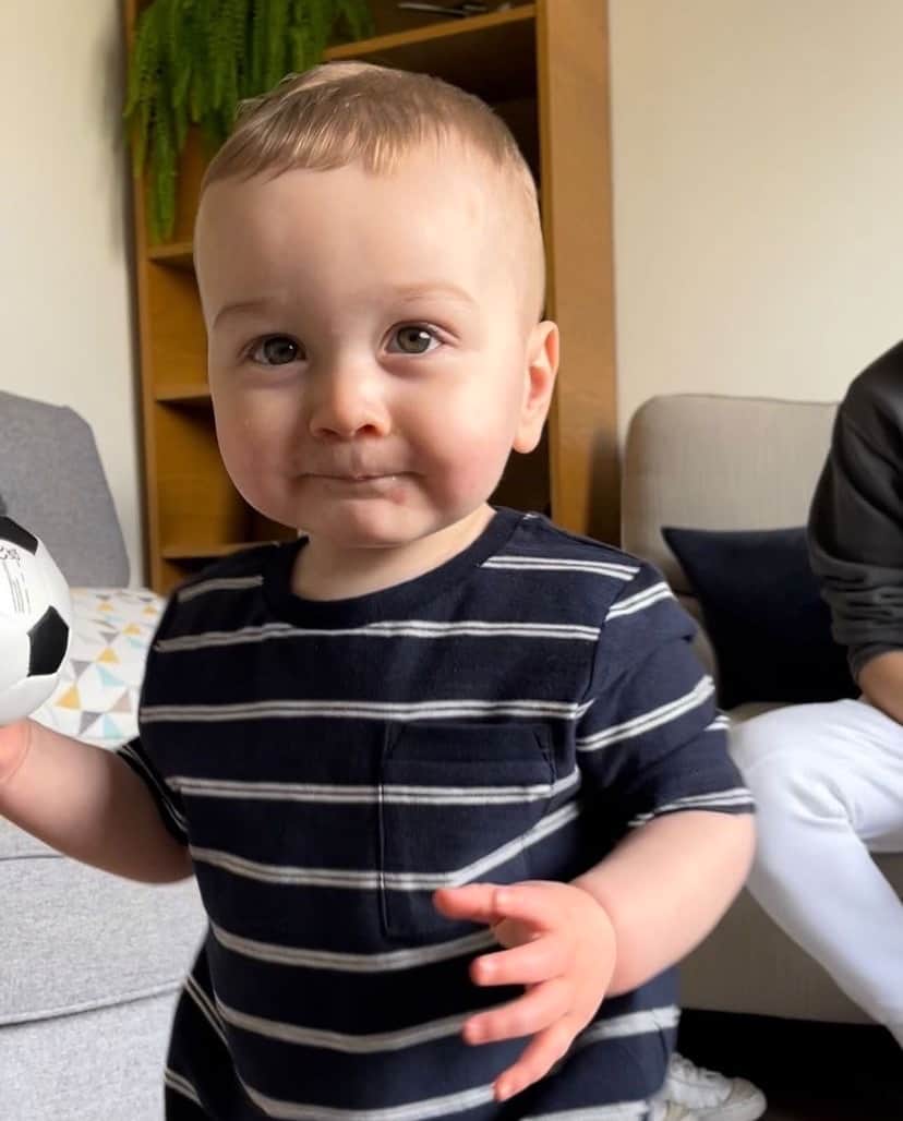 A young boy looking into the camera.