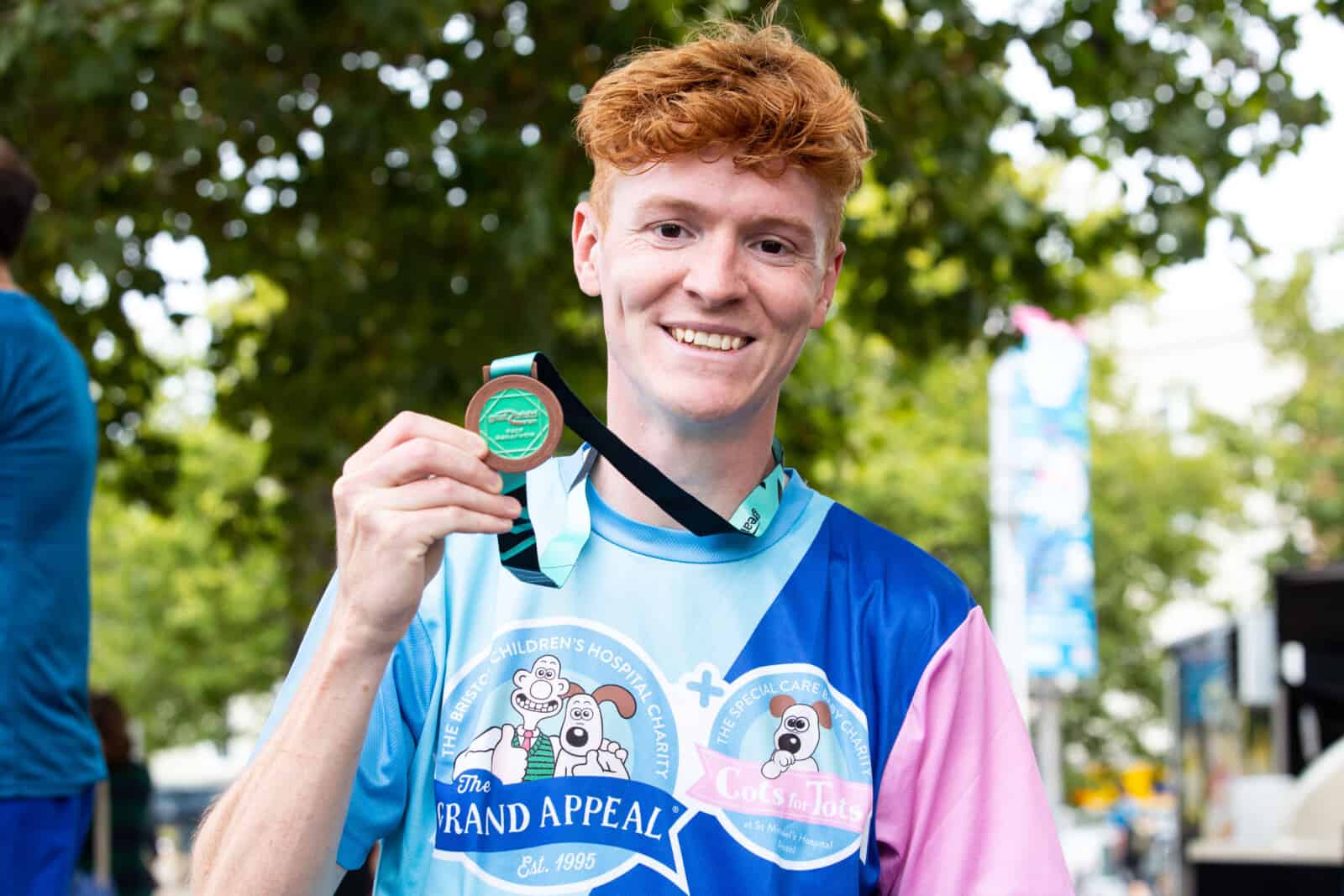 man with a medal at the great bristol run