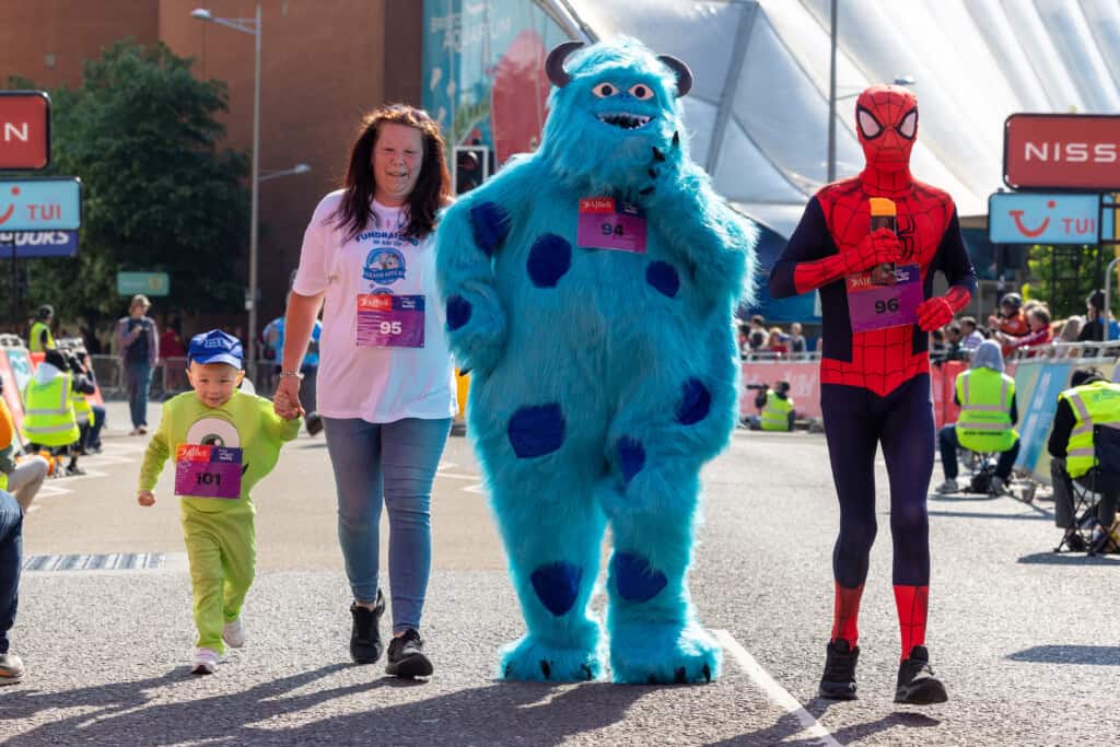 Family in Monsters Inc dress up taking part in the Great Bristol Family Run for The Grand Appeal... They won the costume competition! 