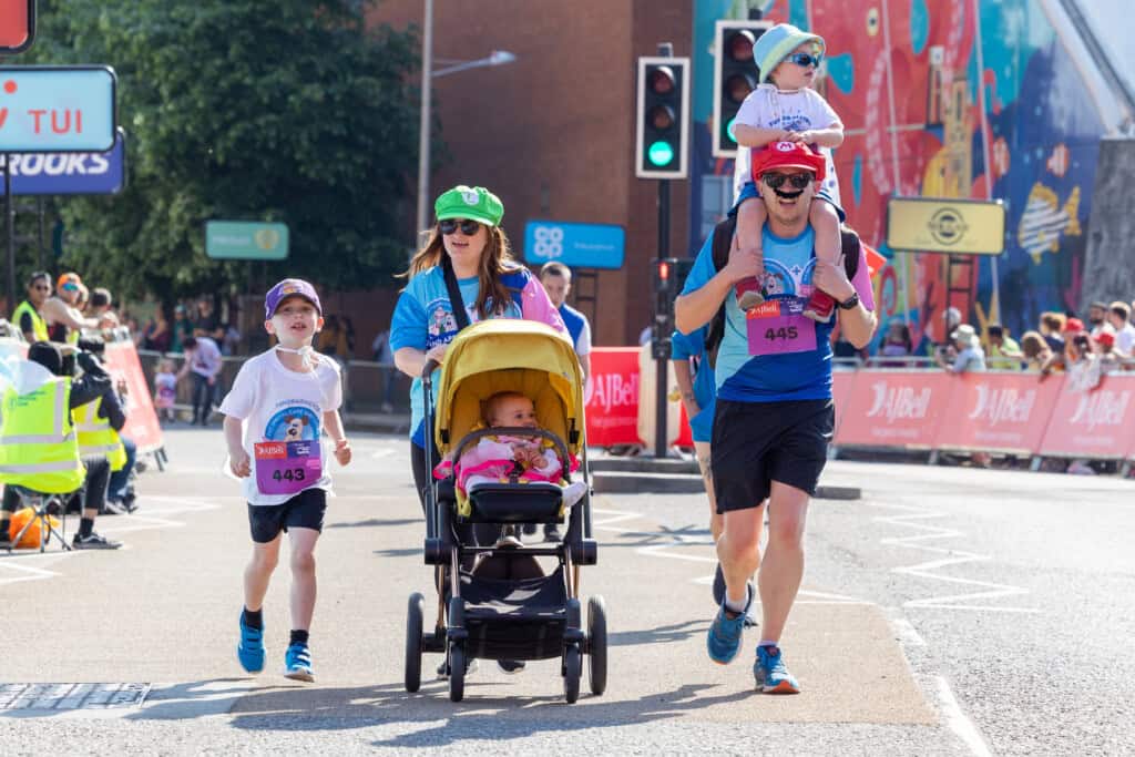 Family dressed as Mario taking part in The Great Bristol Family Run for The Grand Appeal