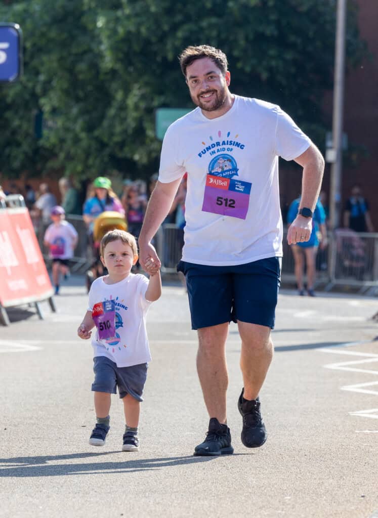 Father and son taking part in the Great Bristol Run for The Grand Appeal 