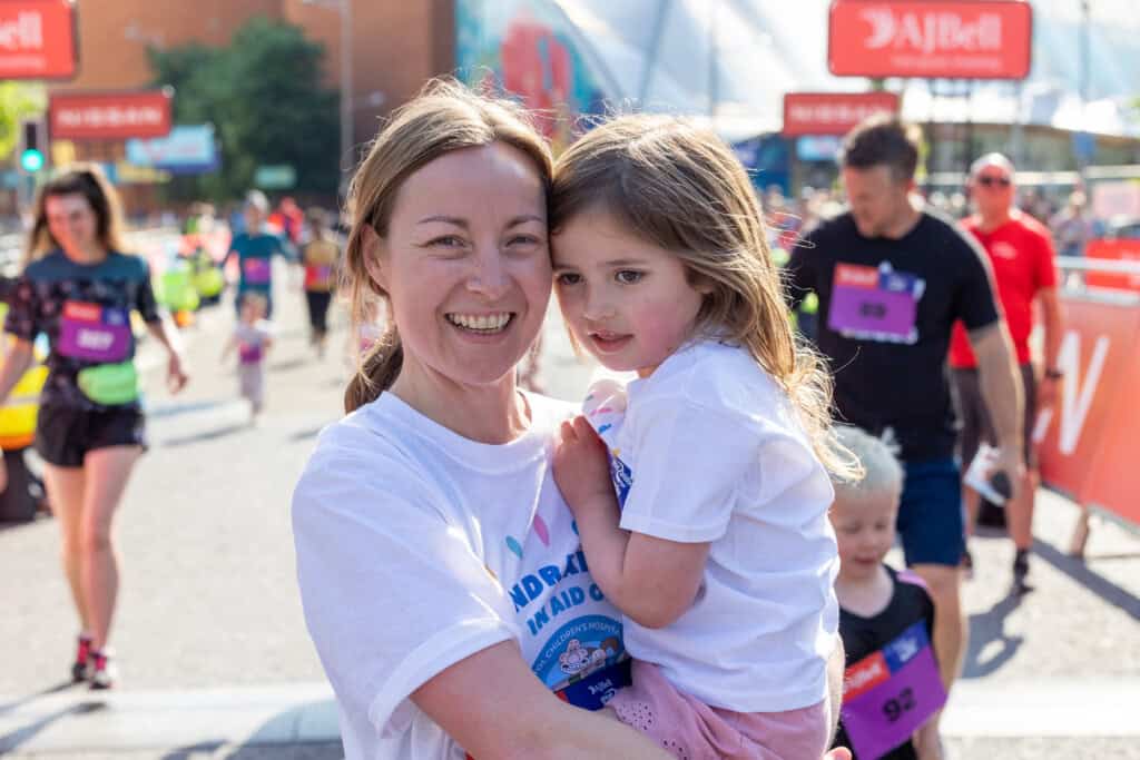 A happy mother and daughter taking part in the Great Bristol Family Run for The Grand Appeal