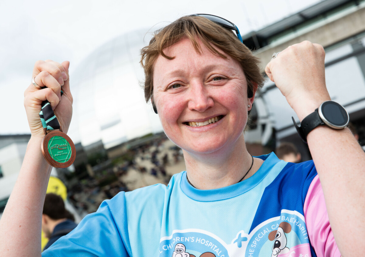 woman with a medal at the great bristol run