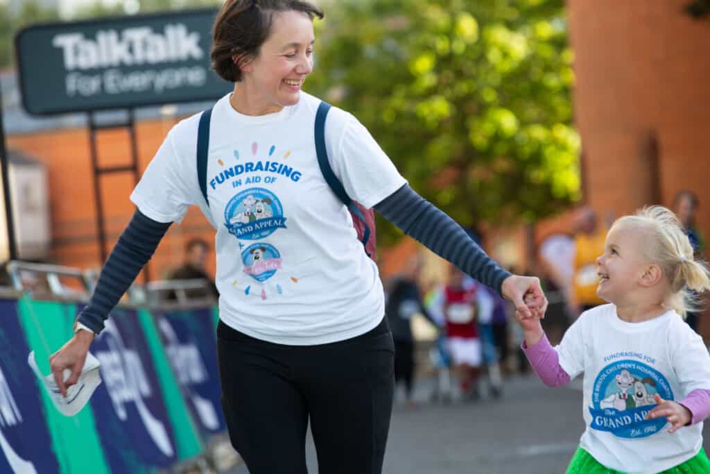 A family taking part in the Great Bristol Family Run for The Grand Appeal and Cots for Tots. 