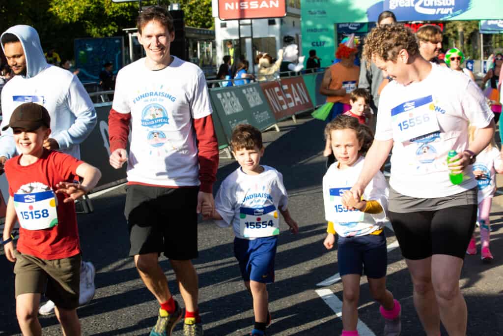 
A family taking part in the Great Bristol Family Run for The Grand Appeal and Cots for Tots. 