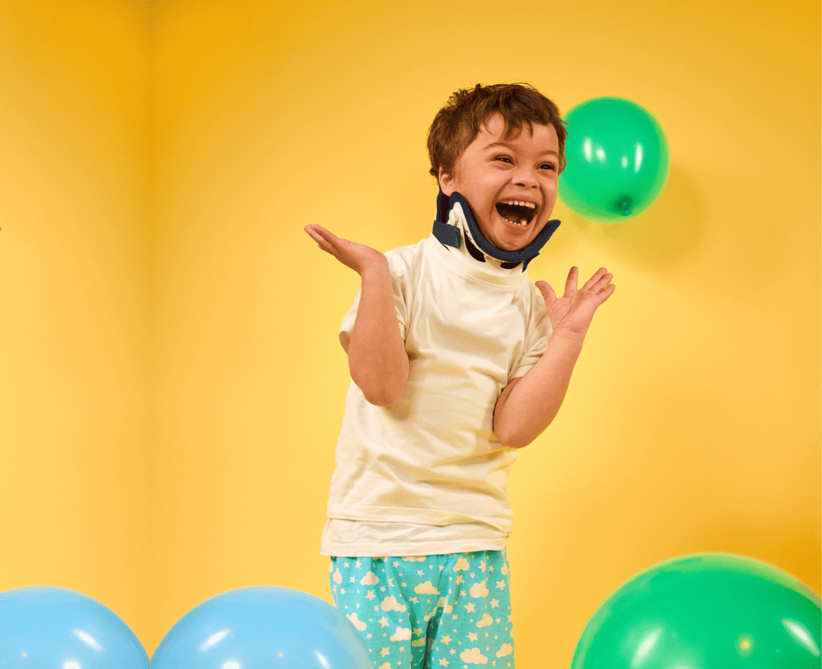 boy dancing with balloons