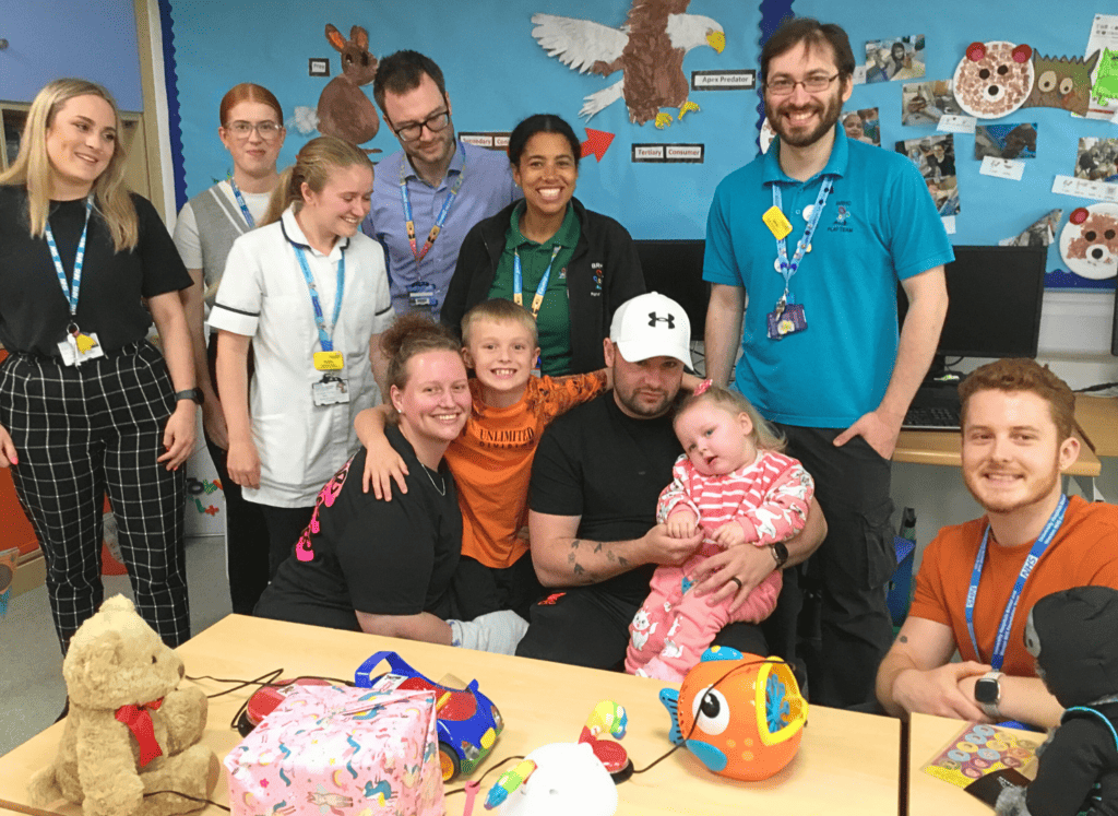 Evee in Bristol Children's Hospital with her family and staff. 