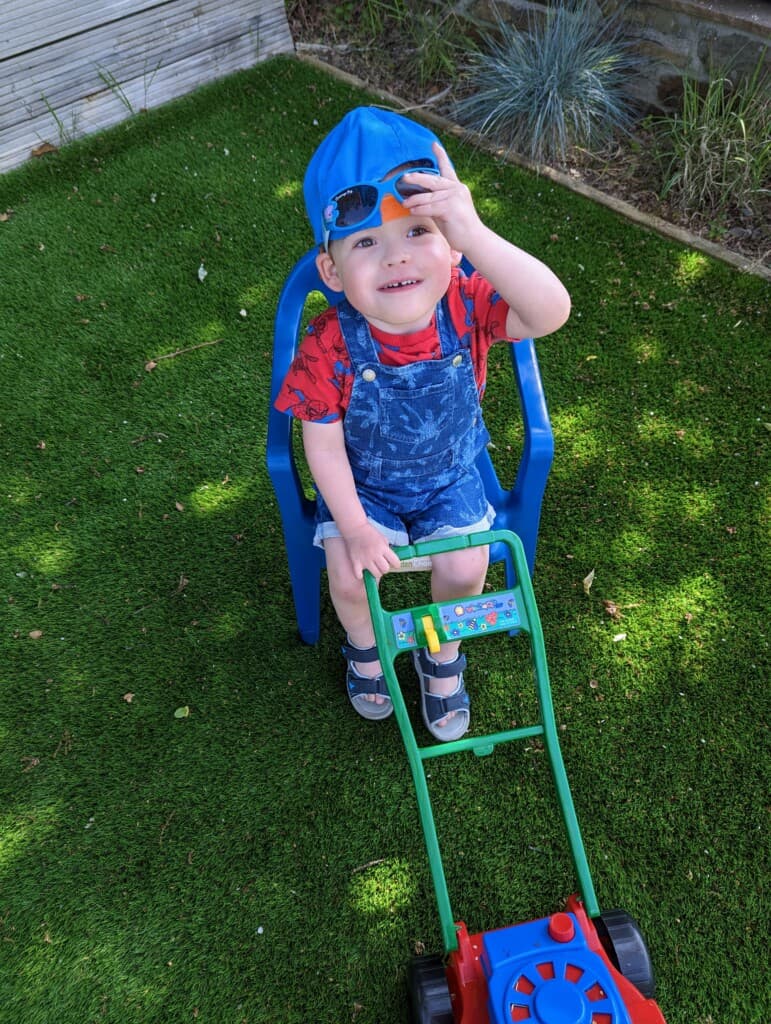 Freddie grown up and smiling at the camera