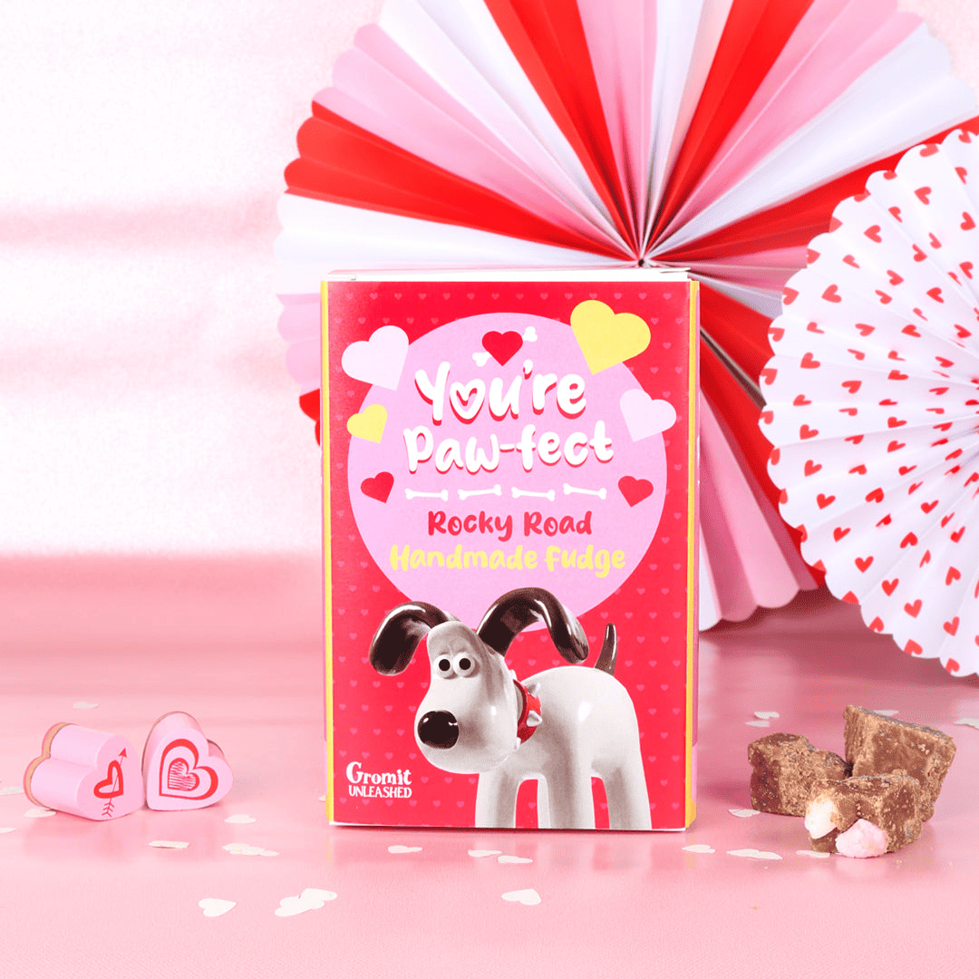 Red and pink box of 'You're Pawfect' Rocky Road favoured fudge. Features Gromit and colourful love hearts.