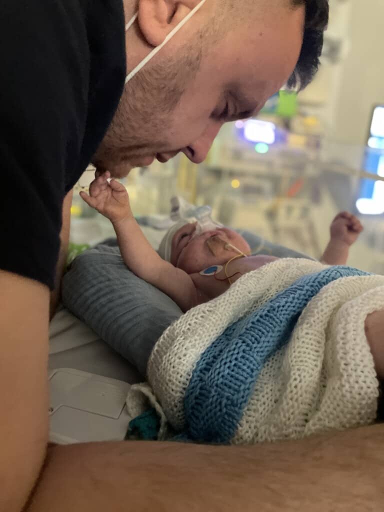 Tommy in care at Bristol Children's Hospital with his Dad, Steve.