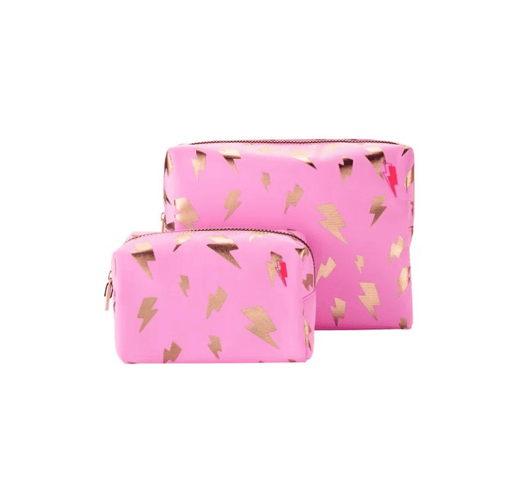 Two Scamp & Dude makeup bags. They are bright pink with rose gold foil lightning bolts.