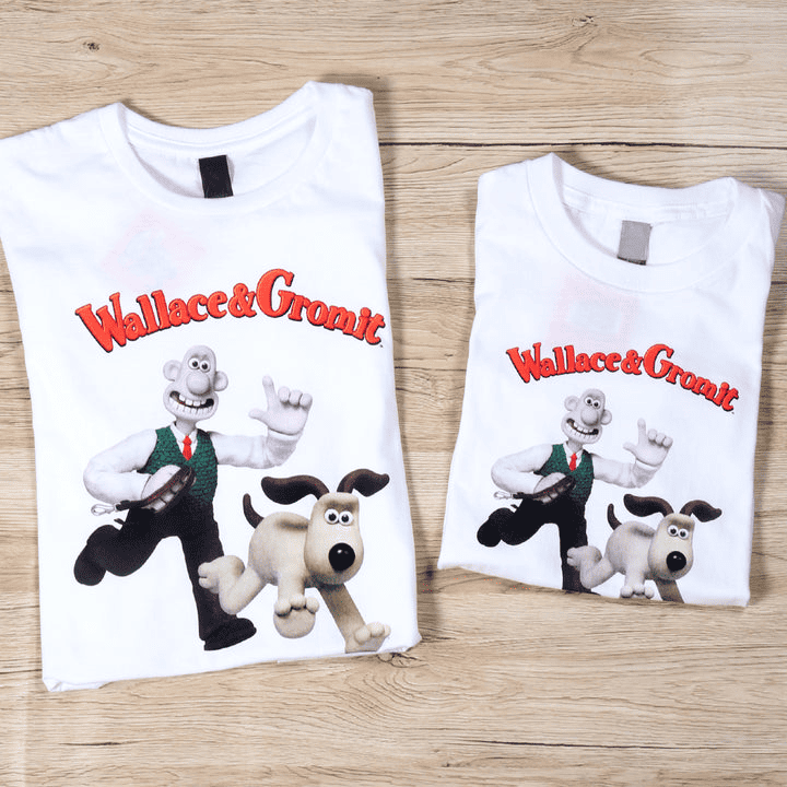 White kid's t-shirt featuring Aardman's Wallace & Gromit running.