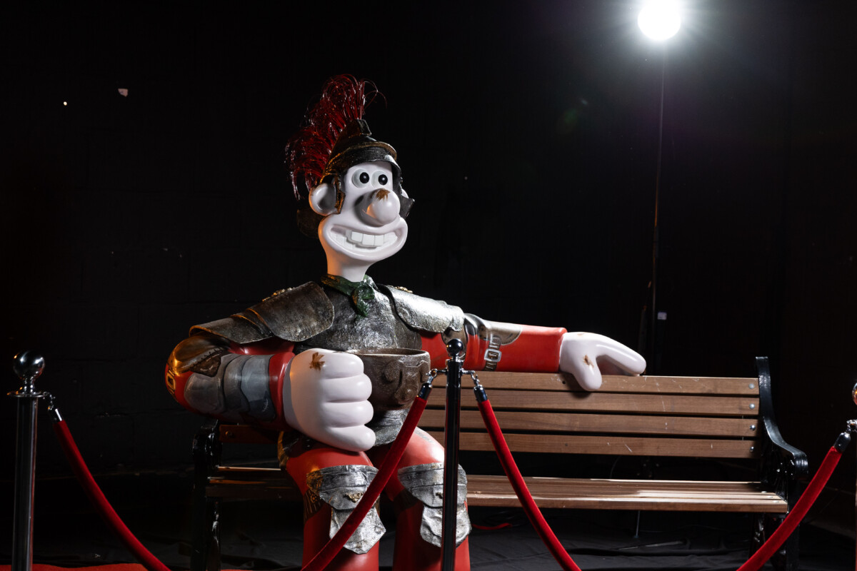 Roman-esque Wallace sculpture sits on a bench as part of Gromit Unleashed 3.