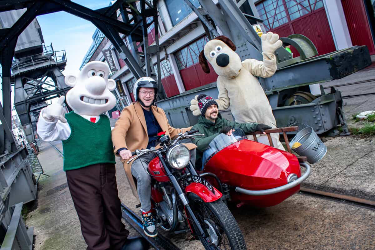 A group of people on a motorcycle and sidecar.