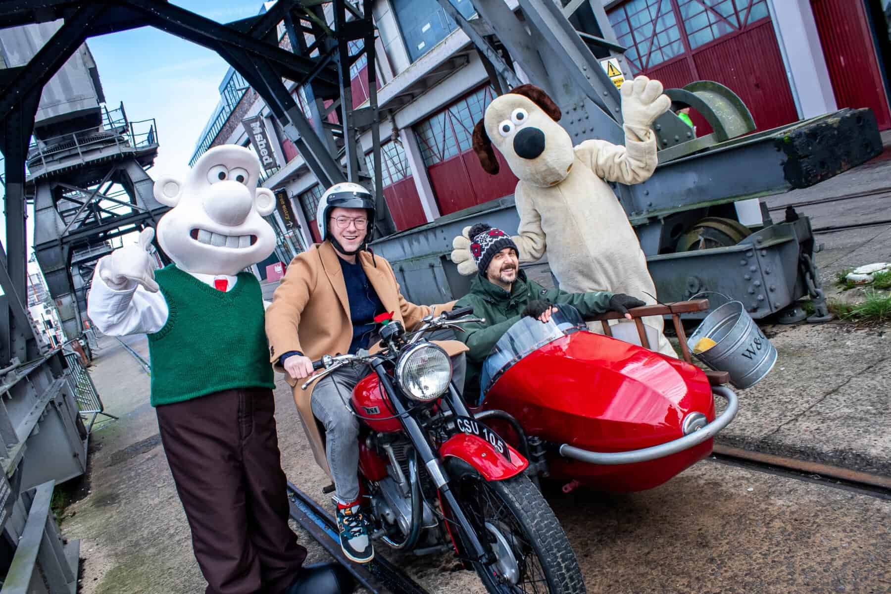 A group of people on a motorcycle and sidecar.