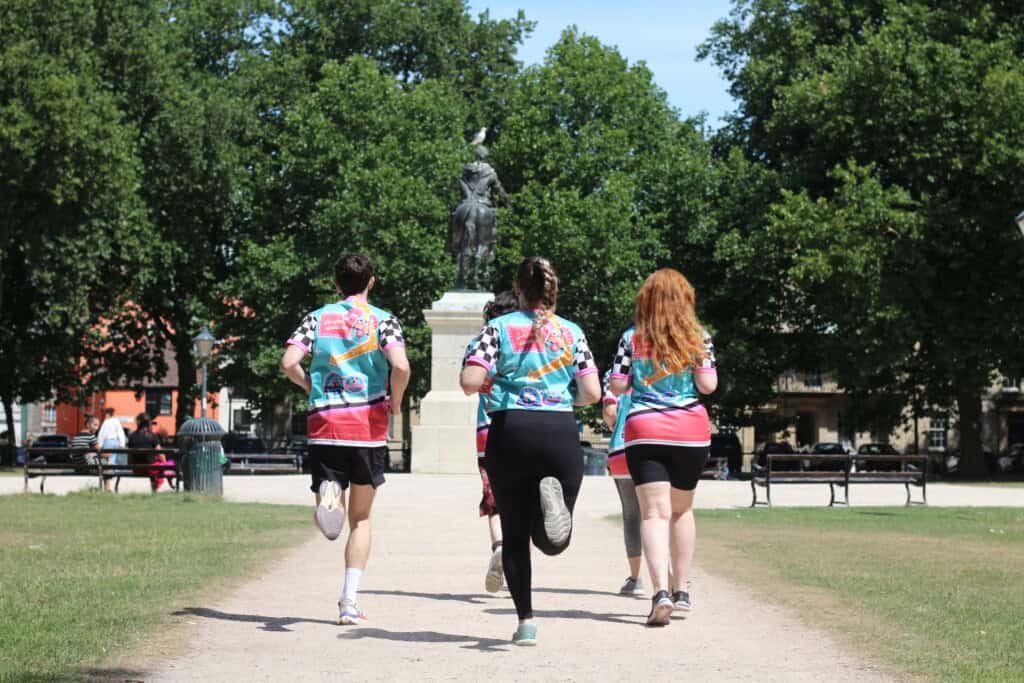 Friends running around Bristol taking part in the 'Hot Dog Dash' to raise money during Gromit Unleashed 3 Trail.