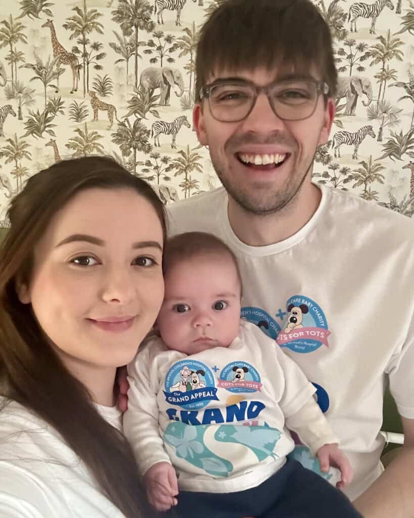 Reid with his parents, Rebecca and Ethan.
